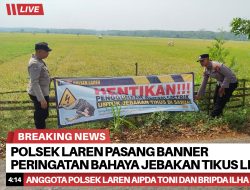Polsek Laren Pasang Banner Peringatan Bahaya Jebakan Tikus Listrik di Sawah